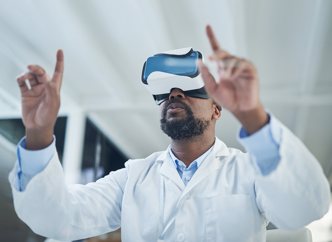 A laboratory professional uses a virtual reality headset in an office.