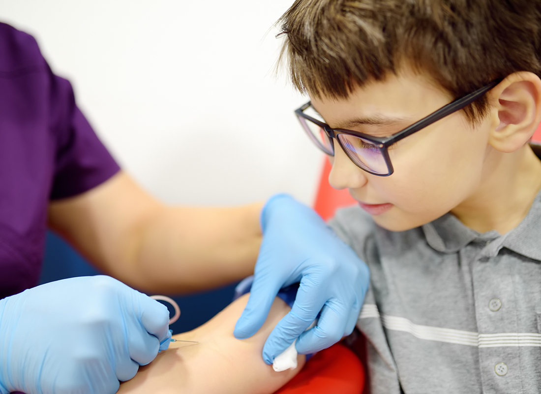 A child having blood drawn for lab testing. Over two-thirds of rare diseases have an exclusively pediatric onset.