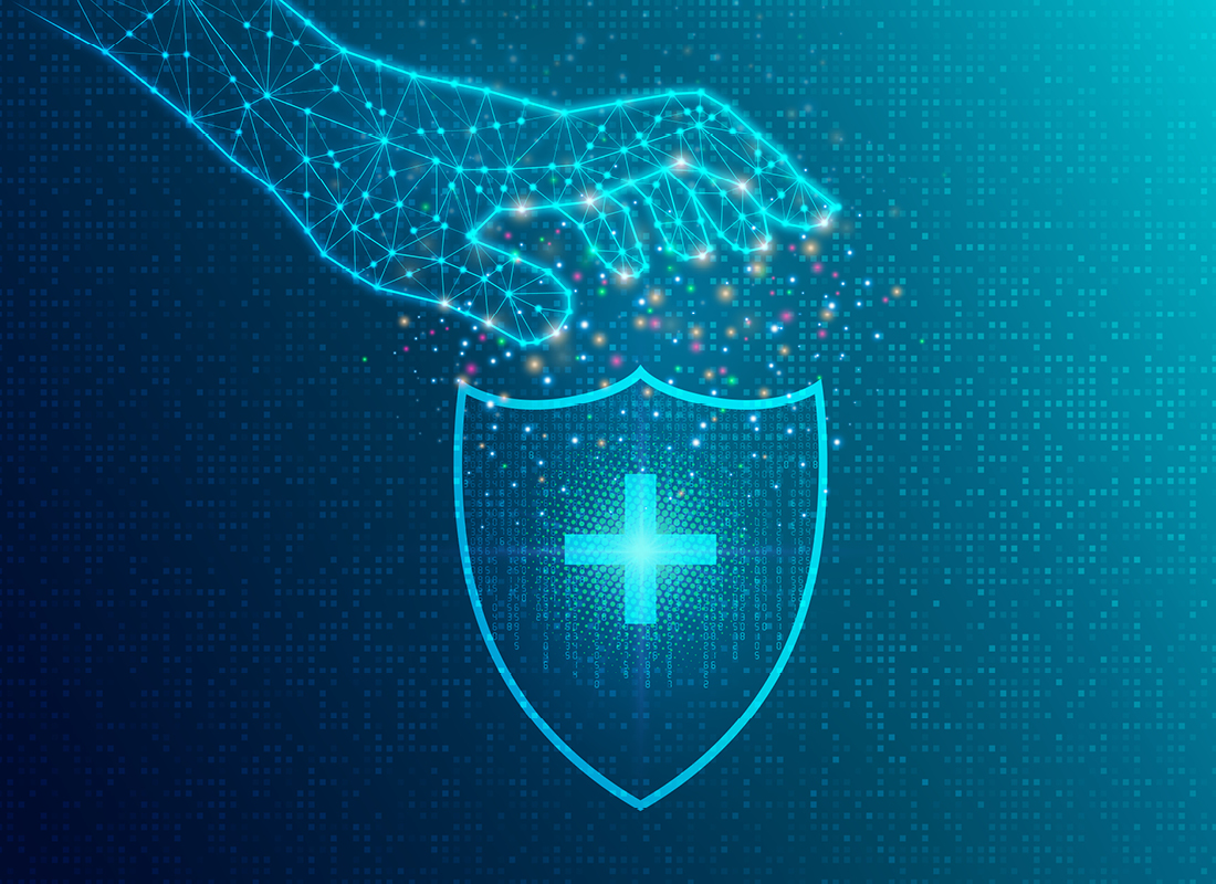 An illustration of a digital hand reaching toward a shield with a healthcare “cross” symbol, showing the concept of healthcare cybersecurity