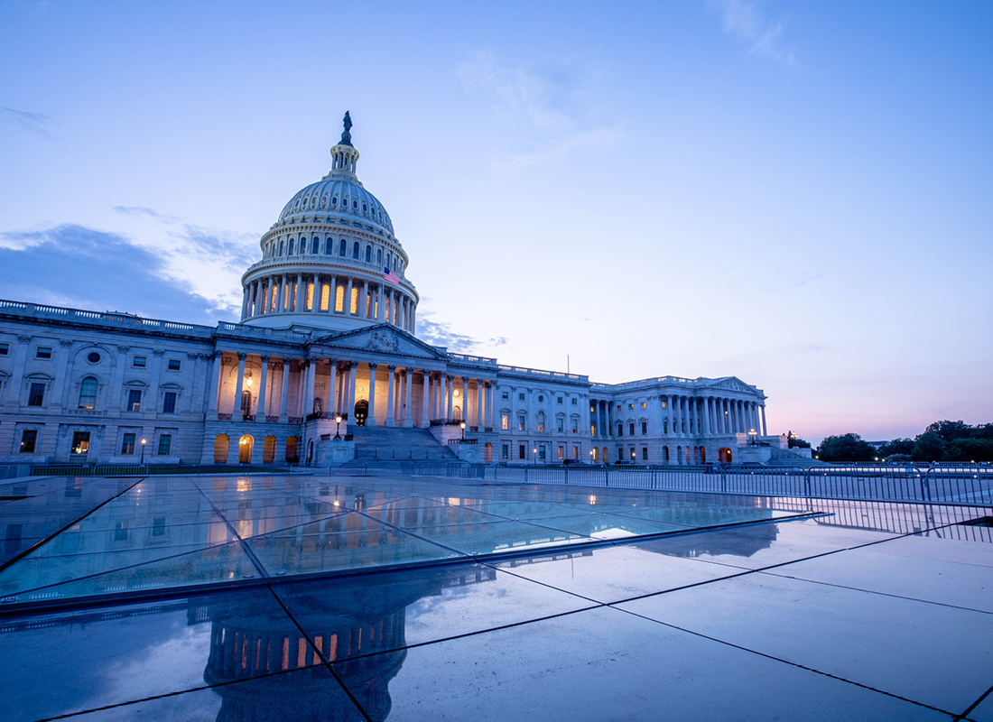 The US Capitol Building at dusk.